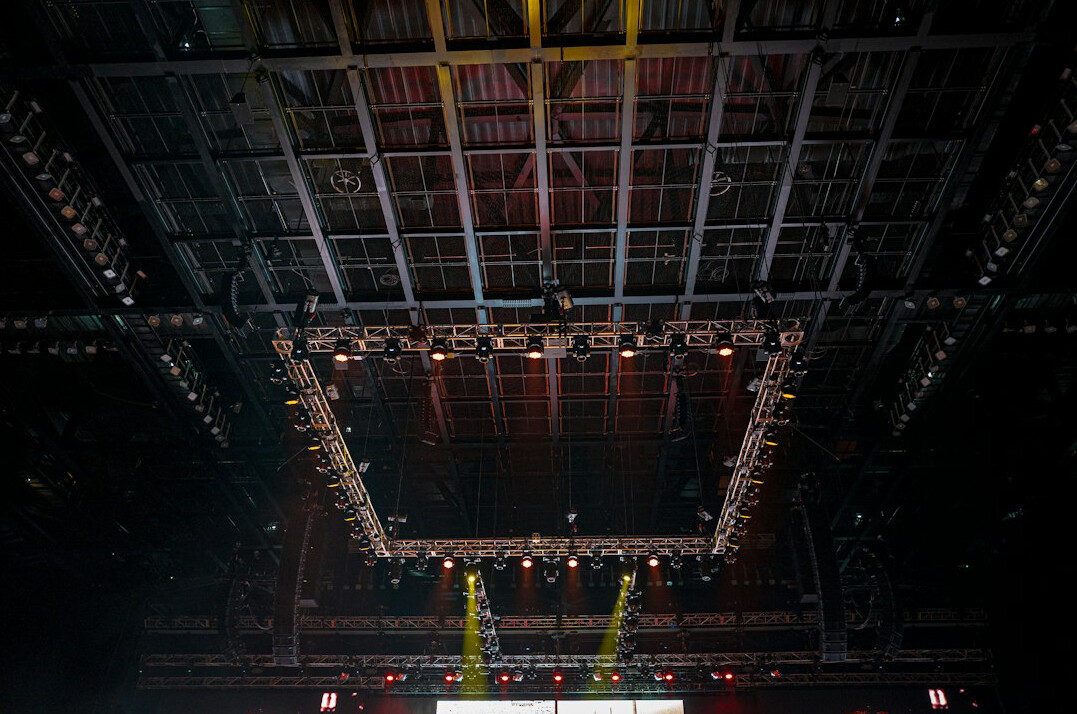 Wide view of an empty TV studio set with lighting rig