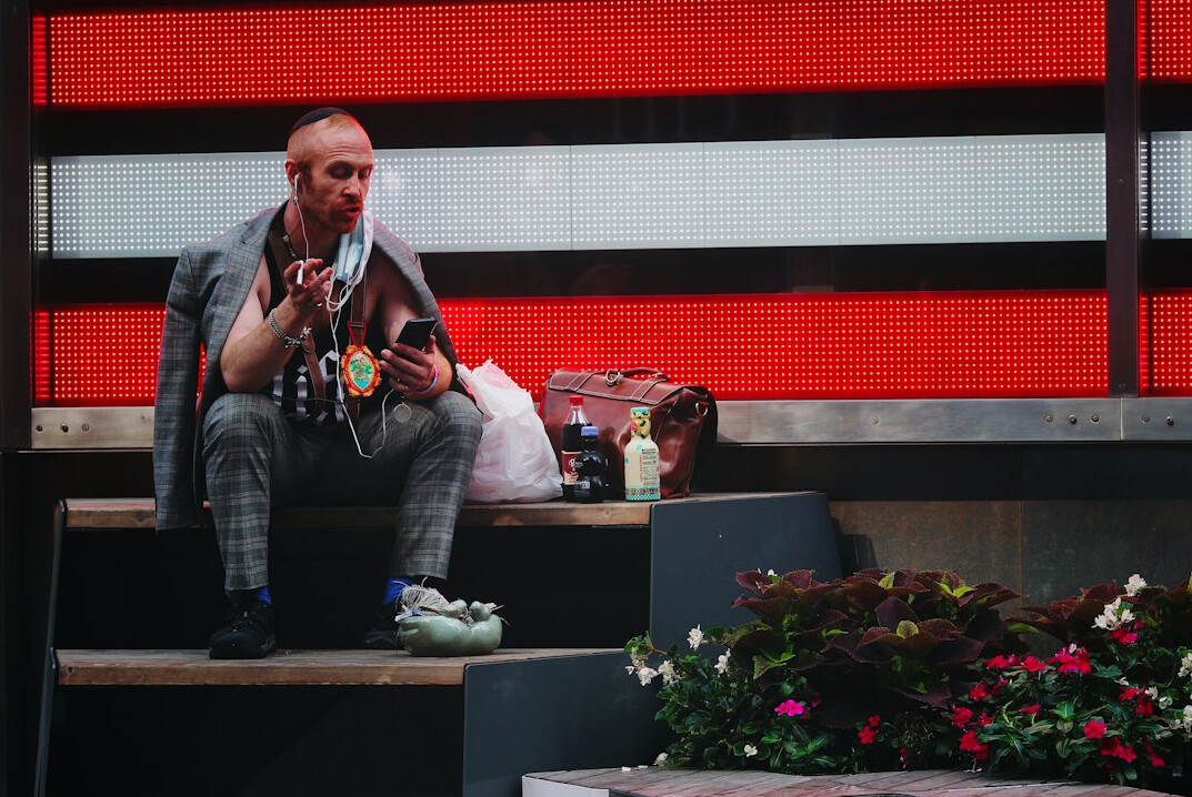 Presenter calmly speaking with a guest on a live TV set